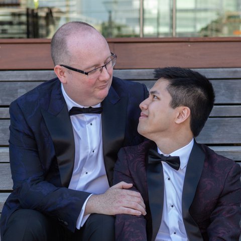 Rob and Minh share a moment in the shade