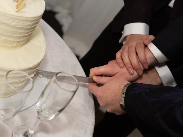 The couple cuts the wedding cake